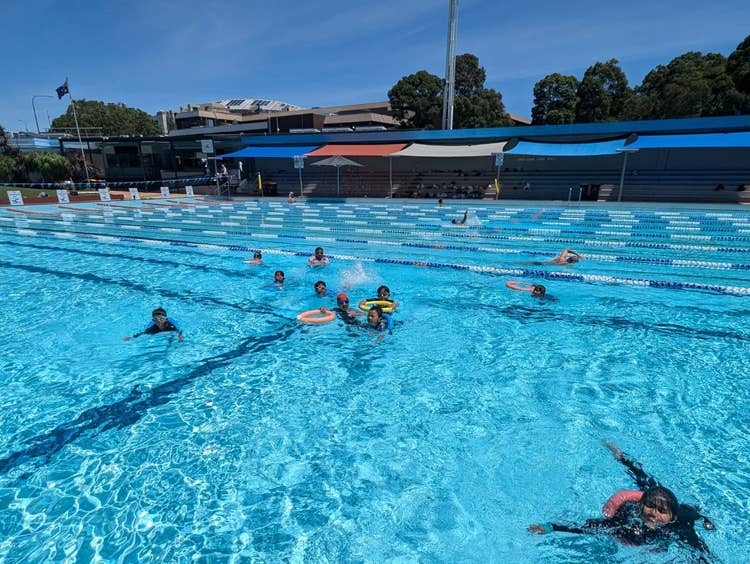 May be an image of swimming and pool